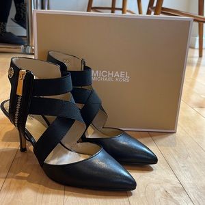 Michael Kors open back, black leather 3 inch heel.